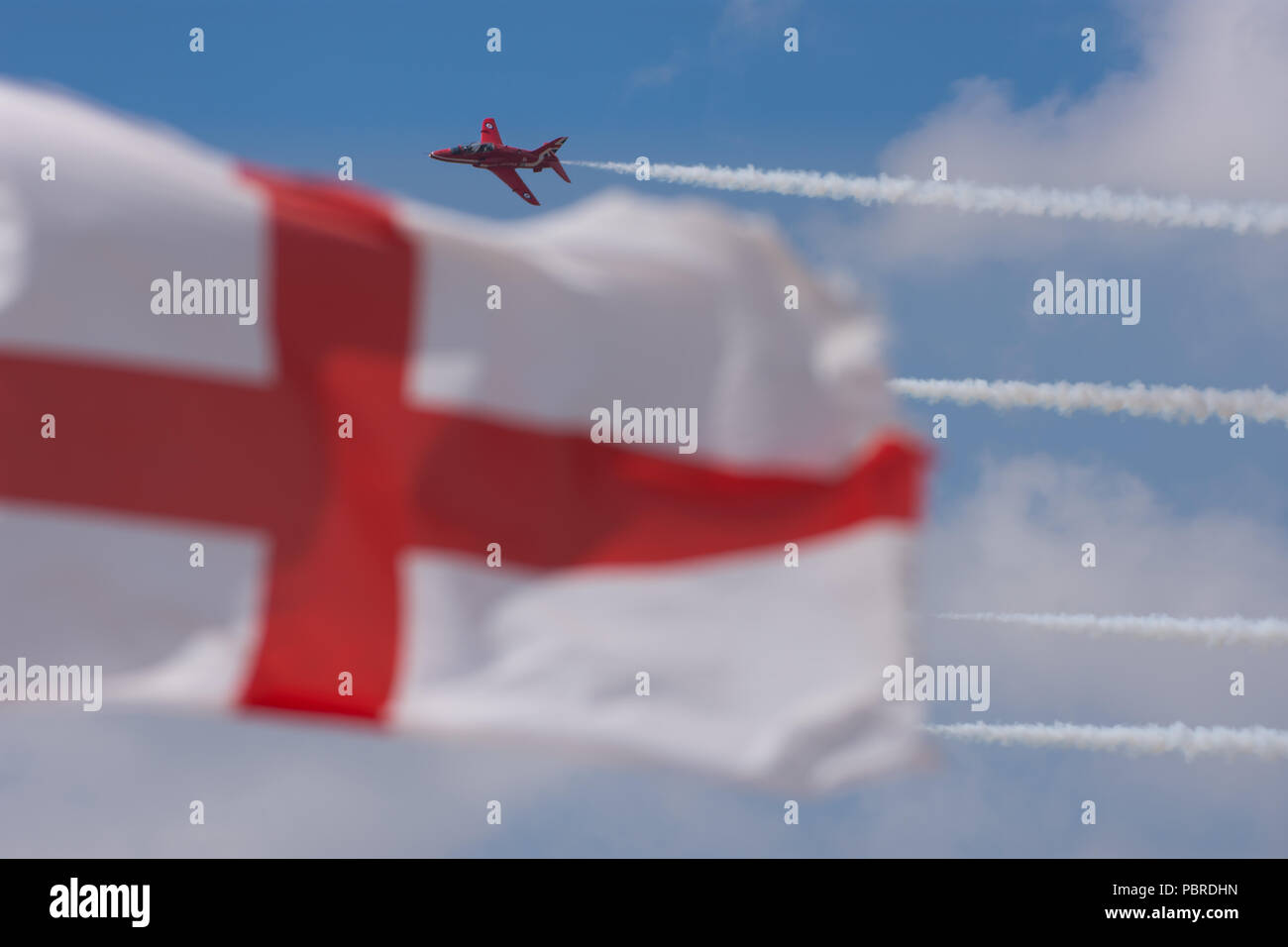RAF Red Arrow behind English Flag RIAT Fairford 2018 Stock Photo