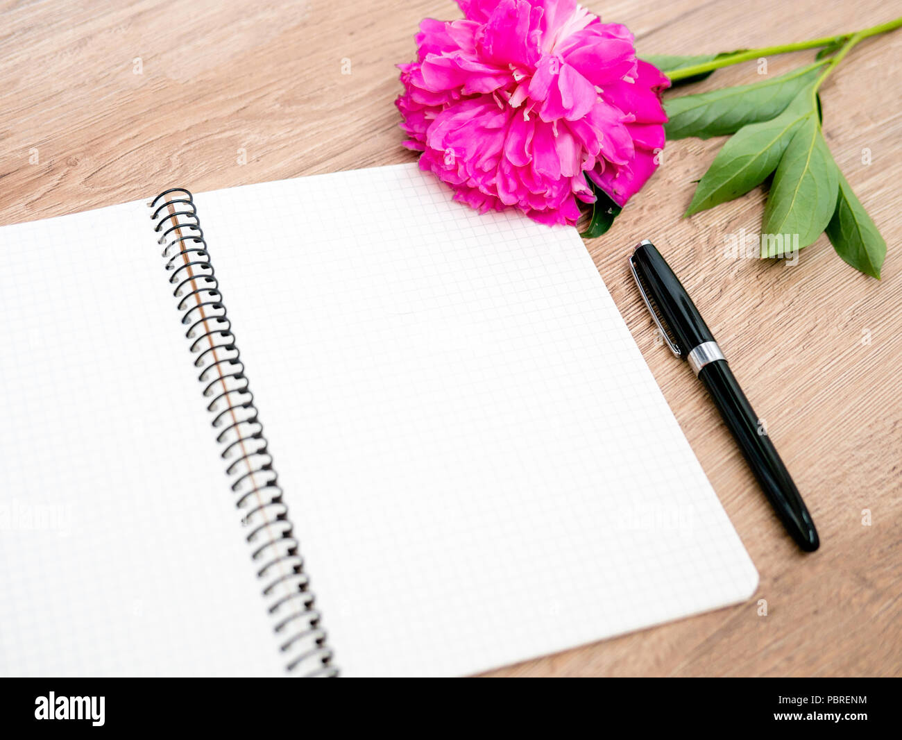 Pink floral assorted pink flower on wooden background with notepad free space, copy space for tekst, Stock Photo
