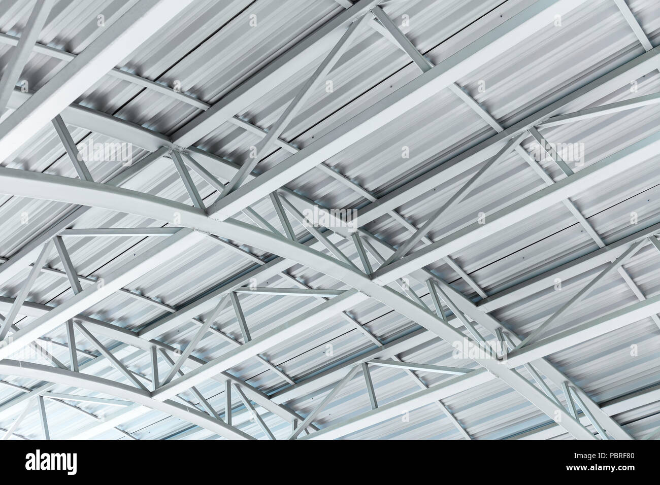 arched metal sheet roof with steel truss structure Stock Photo