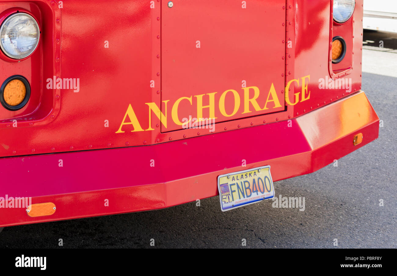 Anchorage, Alaska, USA - July 18, 2018: Anchorage Trolley Tours, red trolley offering tours around Downtown and Greater Anchorage in summertime. Stock Photo