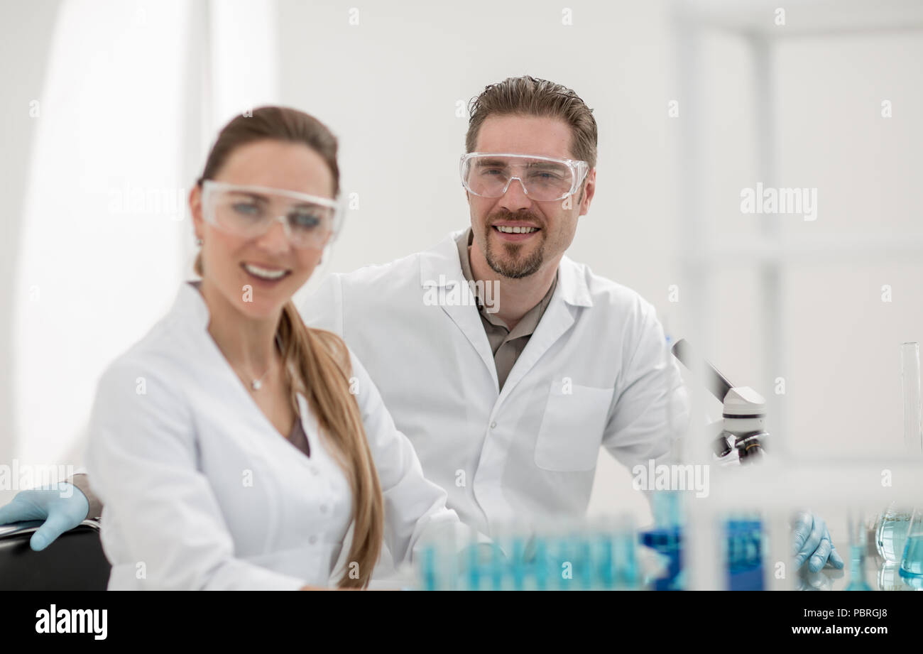 two scientists biologists sitting in a laboratory Stock Photo - Alamy