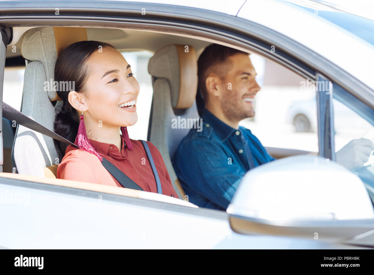Positive nice couple sitting in the car Stock Photo
