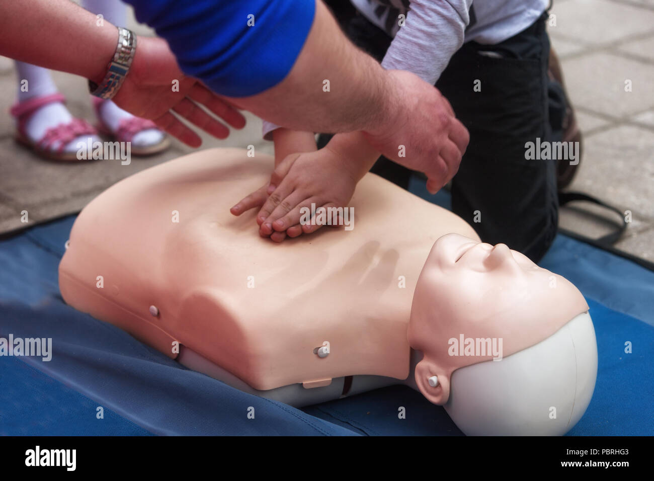 Training on a dummy for the provision of children first aid Stock Photo
