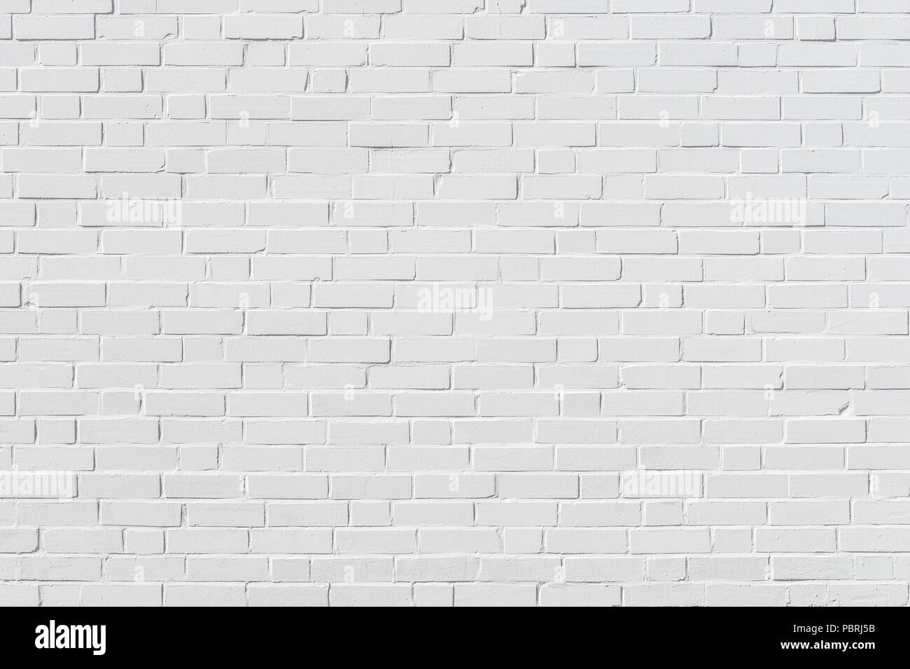 Brick-built wall of white painted bricks, background image Stock Photo