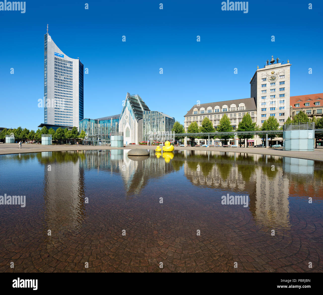 Augustus Square, City highrise, Augusteum and Paulinum of the university, Kroch highrise, water reflection in water basin Stock Photo