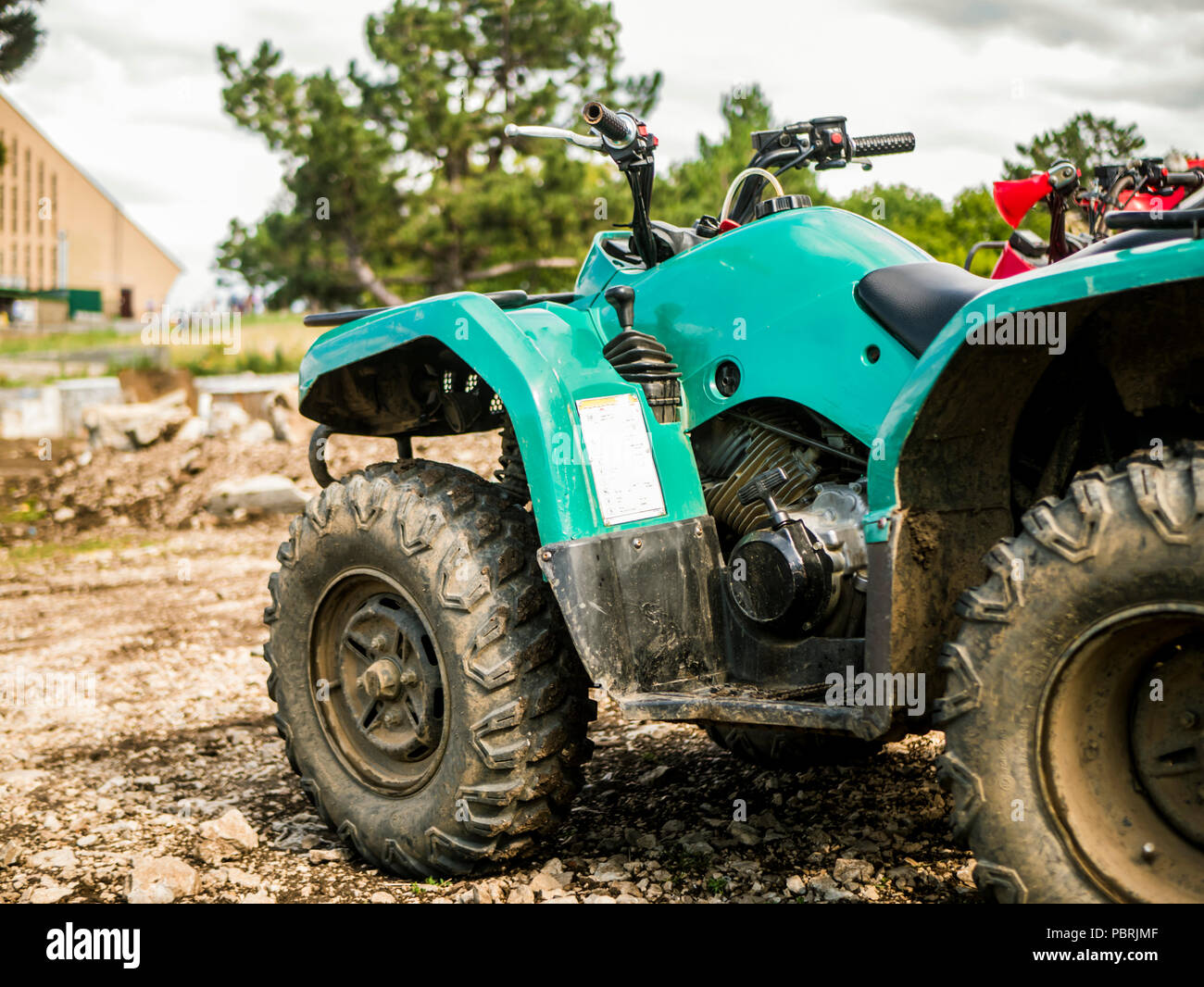 parked atv off road motor vehicle outdoor rainy day Stock Photo - Alamy