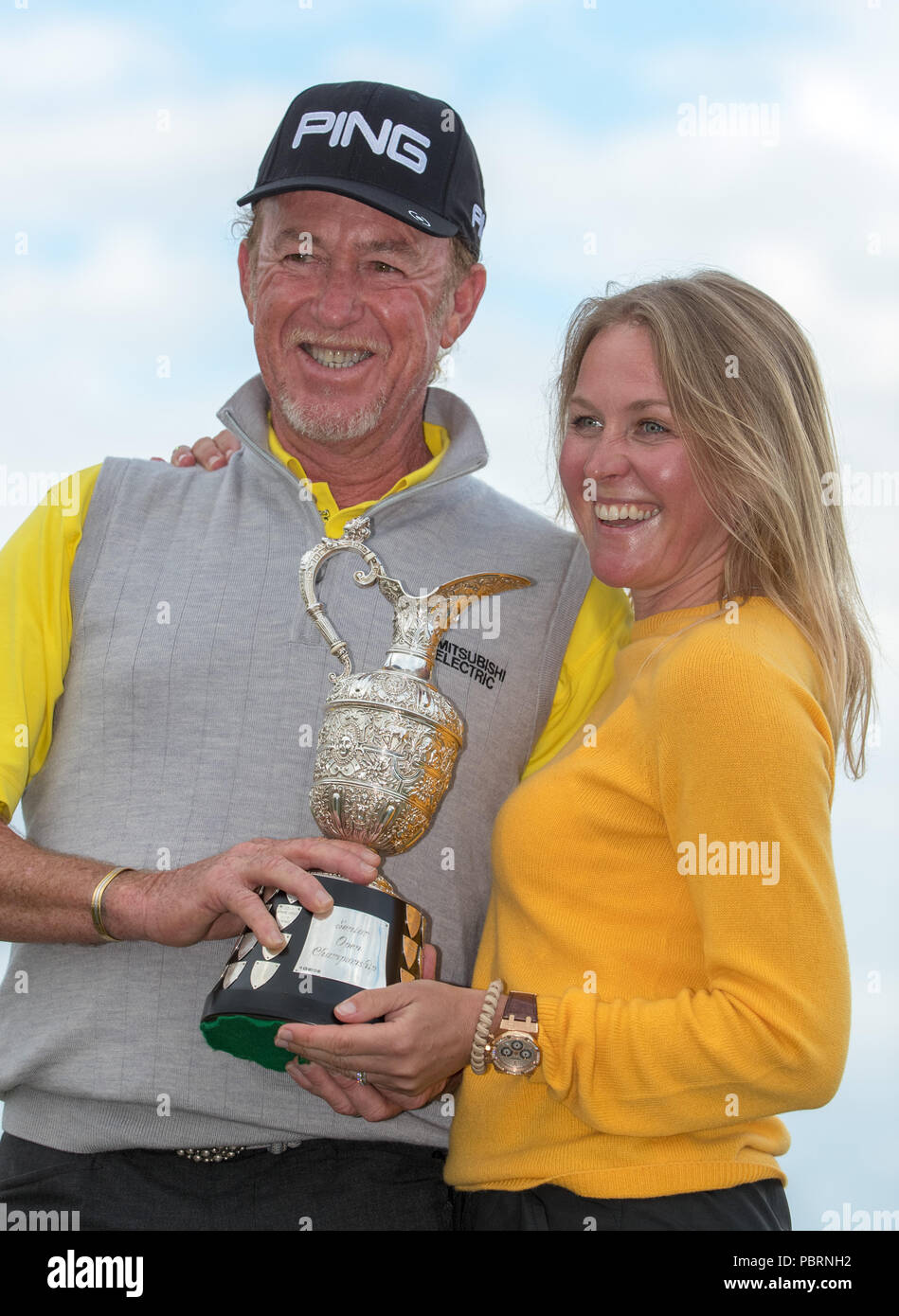 Spain S Miguel Angel Jimenez Celebrates With The Trophy Alongside His Wife Susanna Styblo After Winning The Senior Open At Old Course St Andrews Stock Photo Alamy