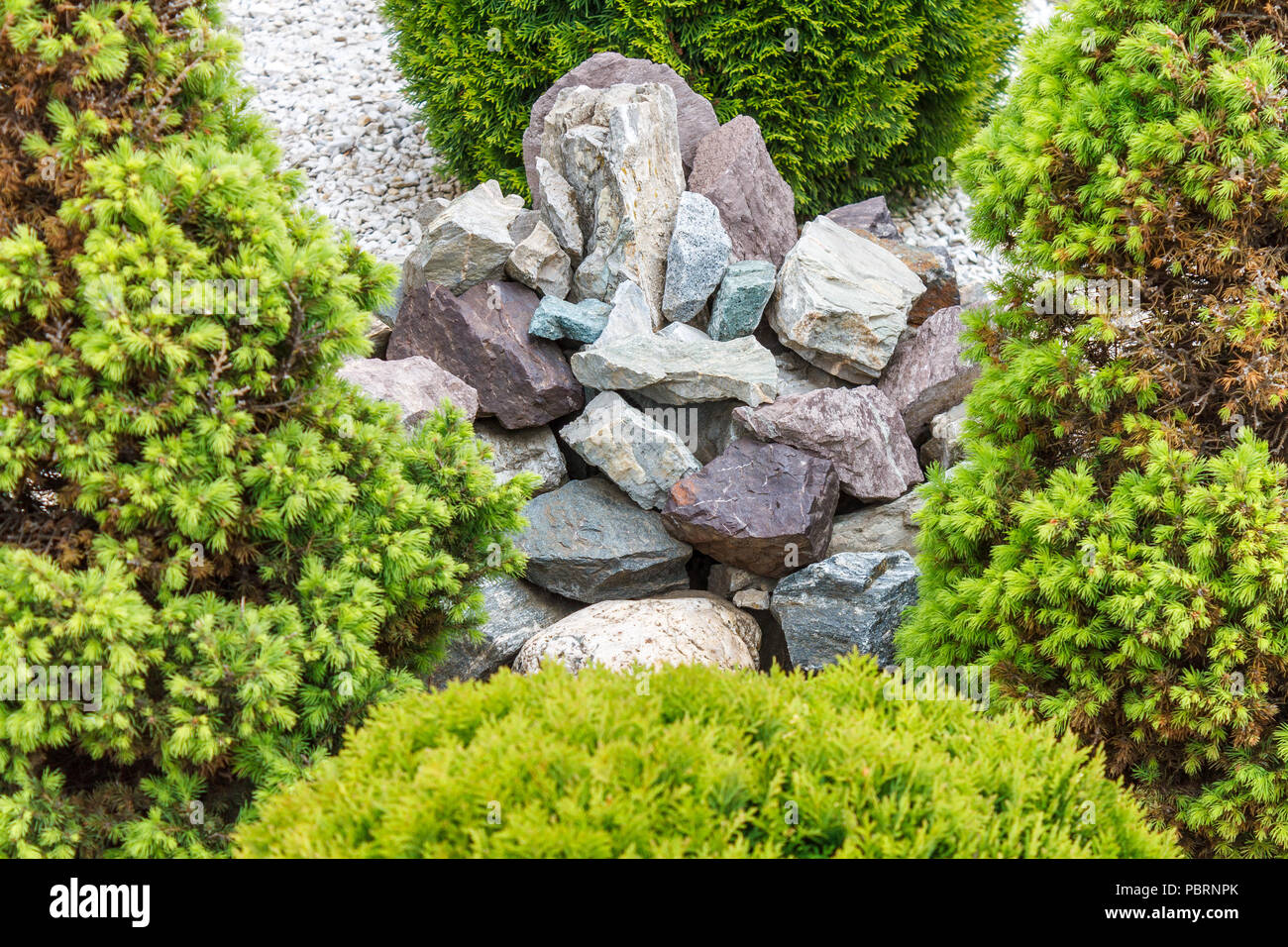 A Group Of Decorative Stones On Pebbles As A Yard Decoration In