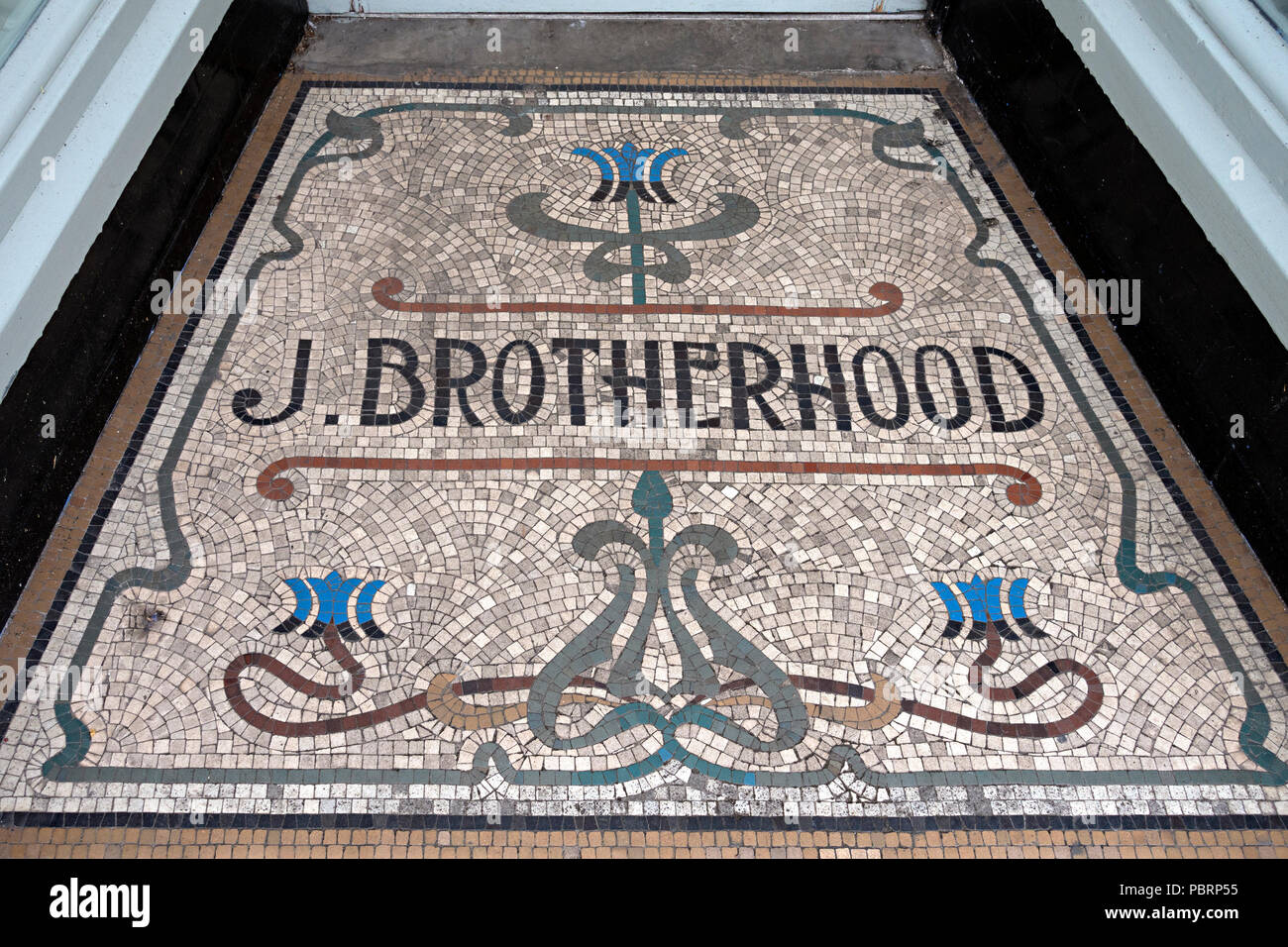 Mosaic tiled floor doorway entrance to old J. Brotherhood clothing shop, Melton Mowbray, Leicestershire Stock Photo