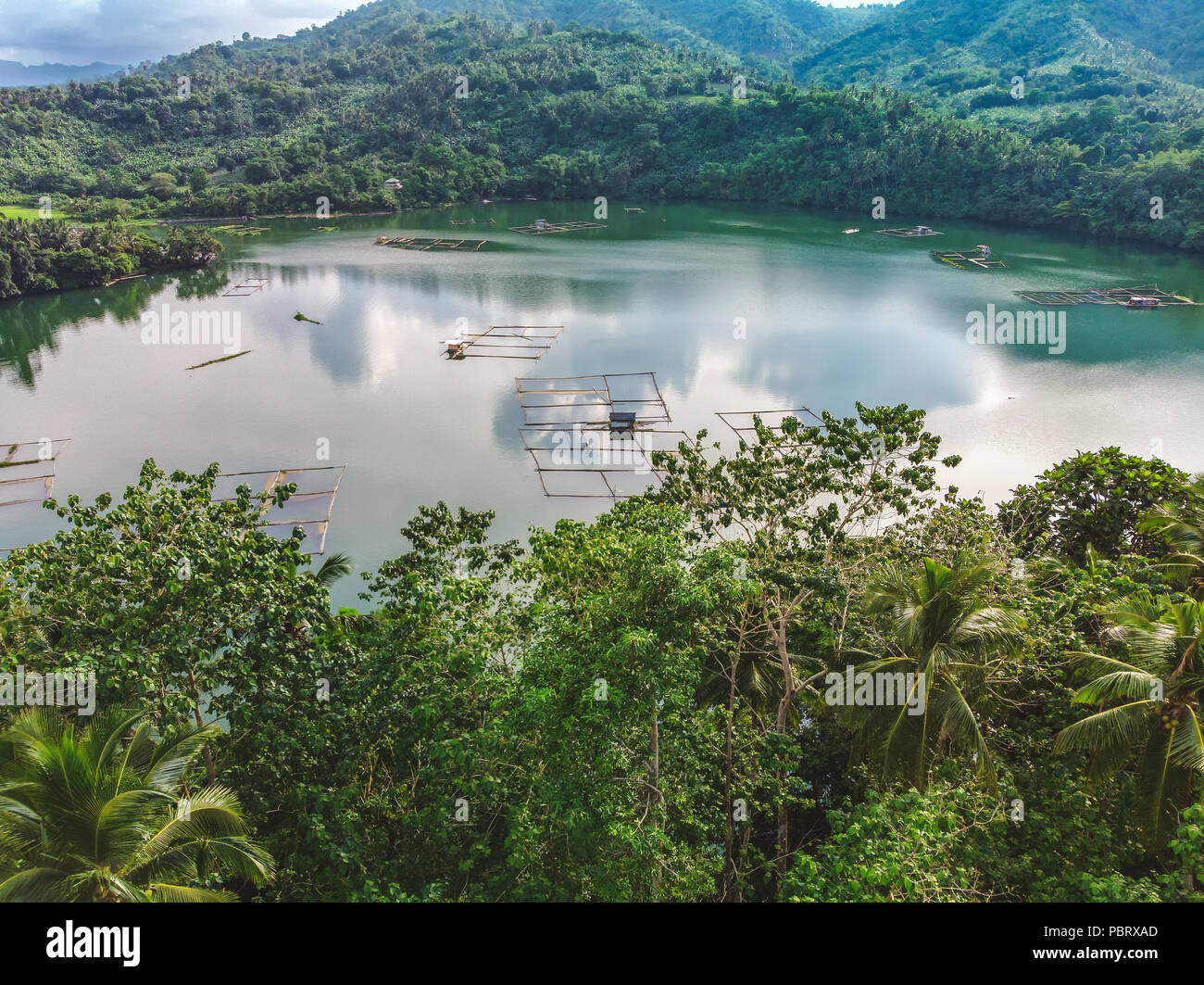Aerial View of the Smallest Lake in San Pablo City, Laguna, Philippines - Lake Mohicap - in a cloudy afternoon Stock Photo