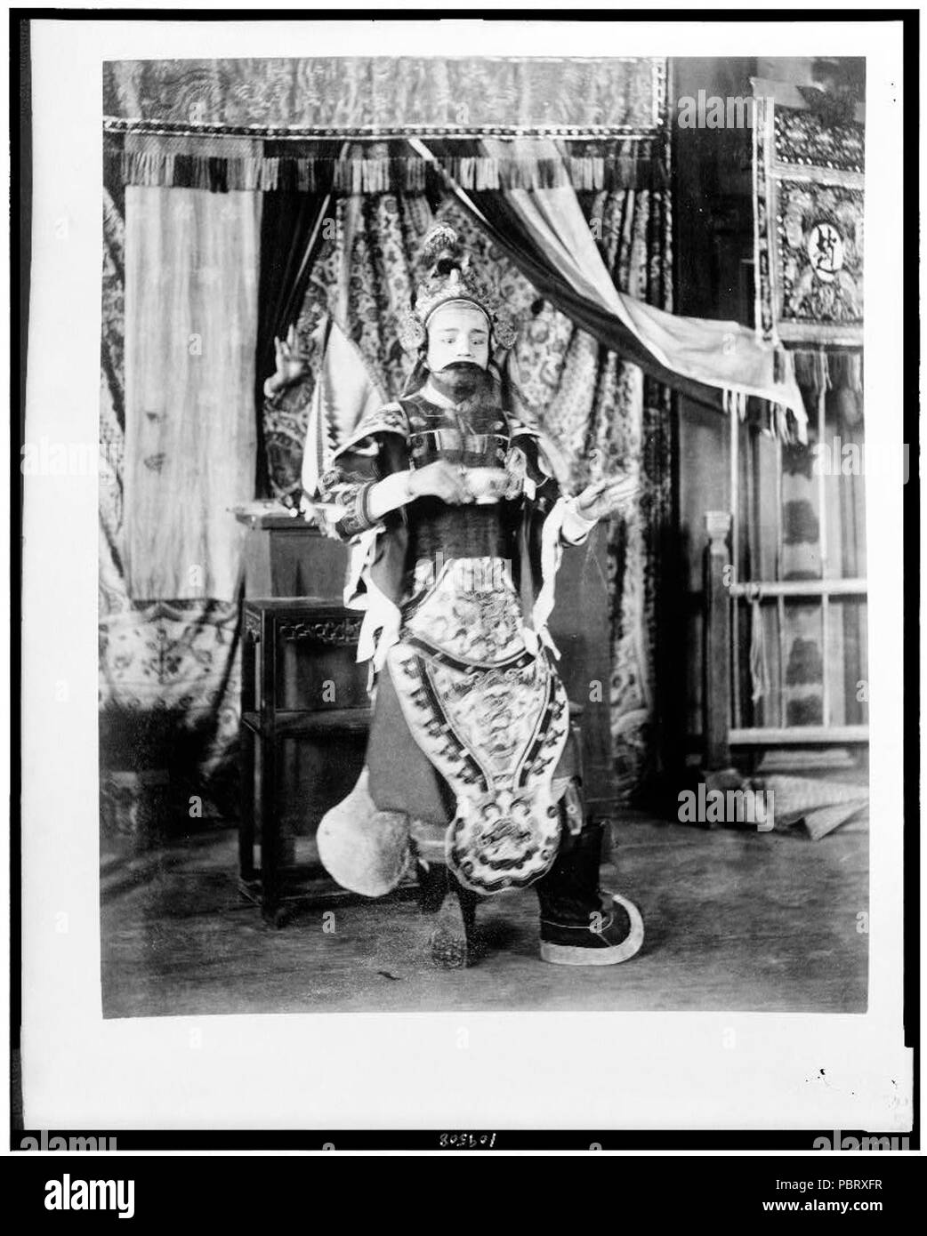 Actor from Theatre Annamite, full-length portrait, in costume, Paris Exposition, 1889 Stock Photo