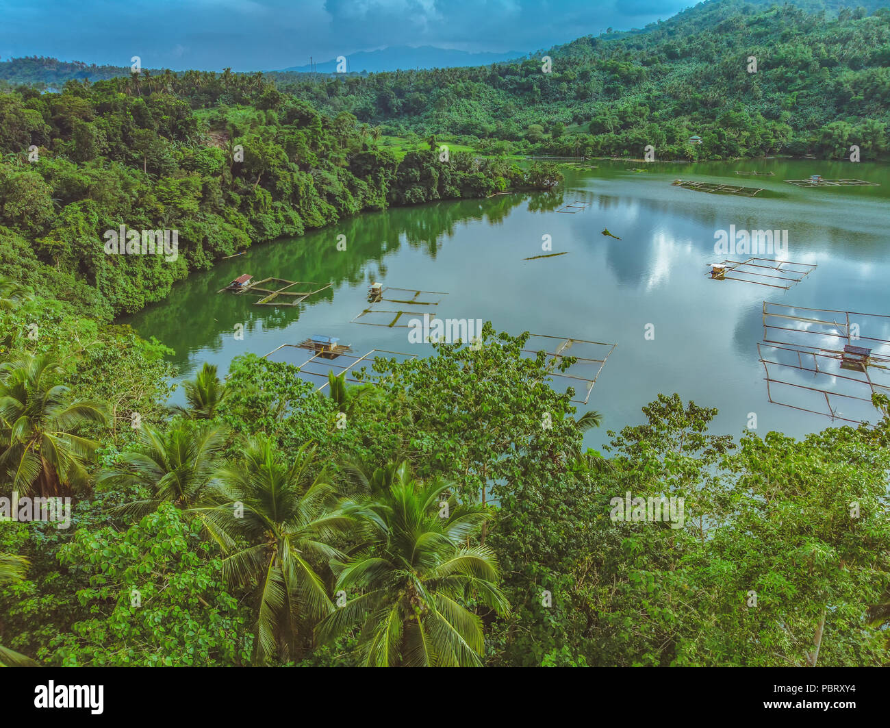 Aerial View of the Smallest Lake in San Pablo City, Laguna, Philippines - Lake Mohicap - in a cloudy afternoon Stock Photo