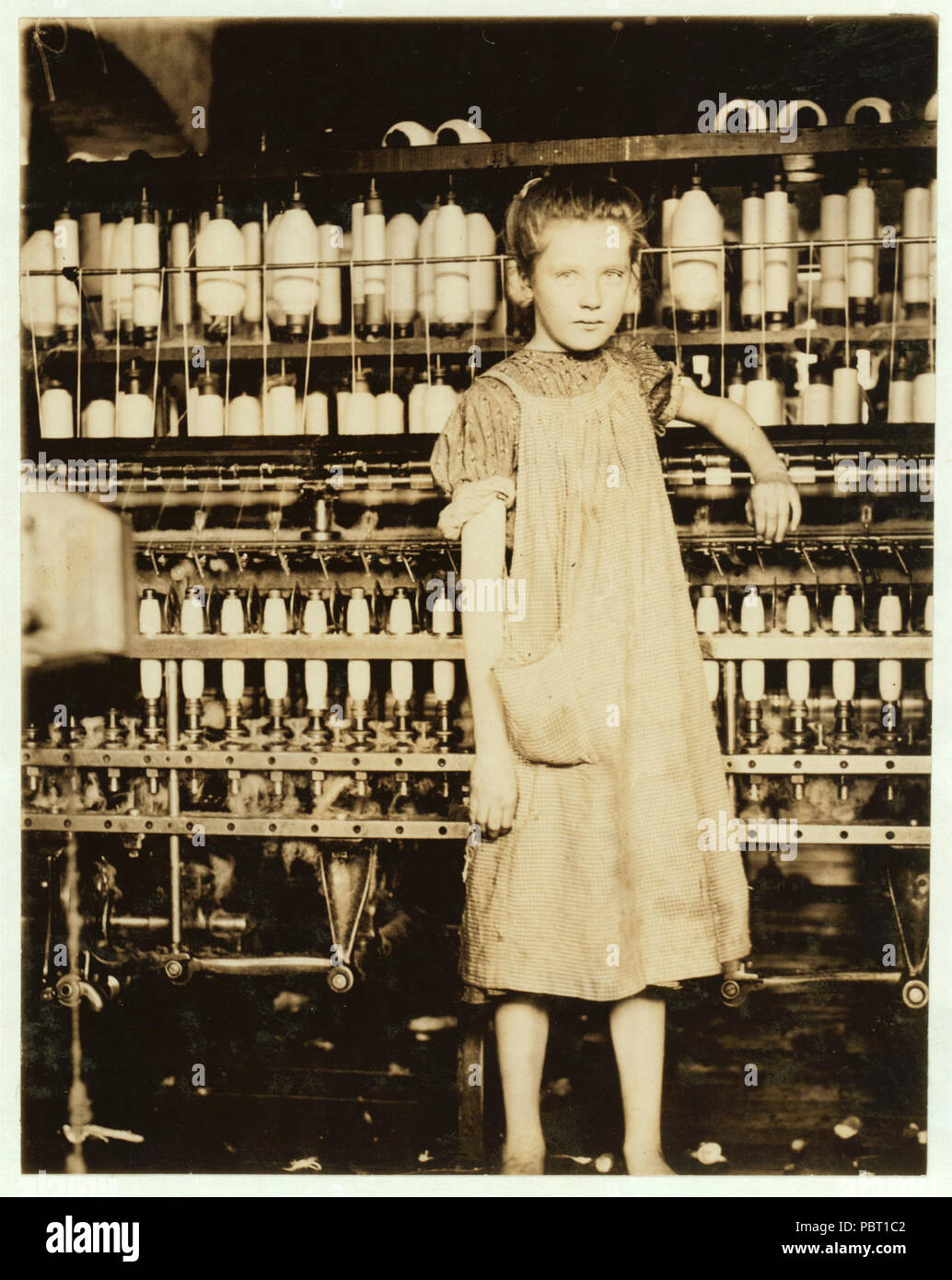 Addie Card, 12 years. Spinner in North Pormal (i.e., Pownal) Cotton Mill. Vt. Girls in mill say she is ten years. She admitted to me she was twelve; that she started during school vacation Stock Photo