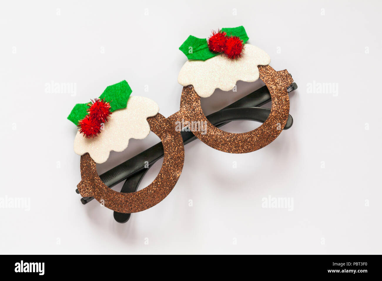 Novelty Christmas Pudding sparkly glasses for Christmas isolated on white background Stock Photo