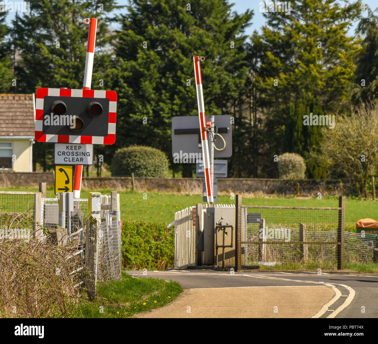 Rural Railway Level Crossing With Barriers Down Across Roadway For Approaching Train With Warning Signs And Lights Stock Photo Alamy Rural Railway Level Crossing With Barriers Down Across Roadway For Approaching Train With Warning Signs And Lights Stock Photo Alamy