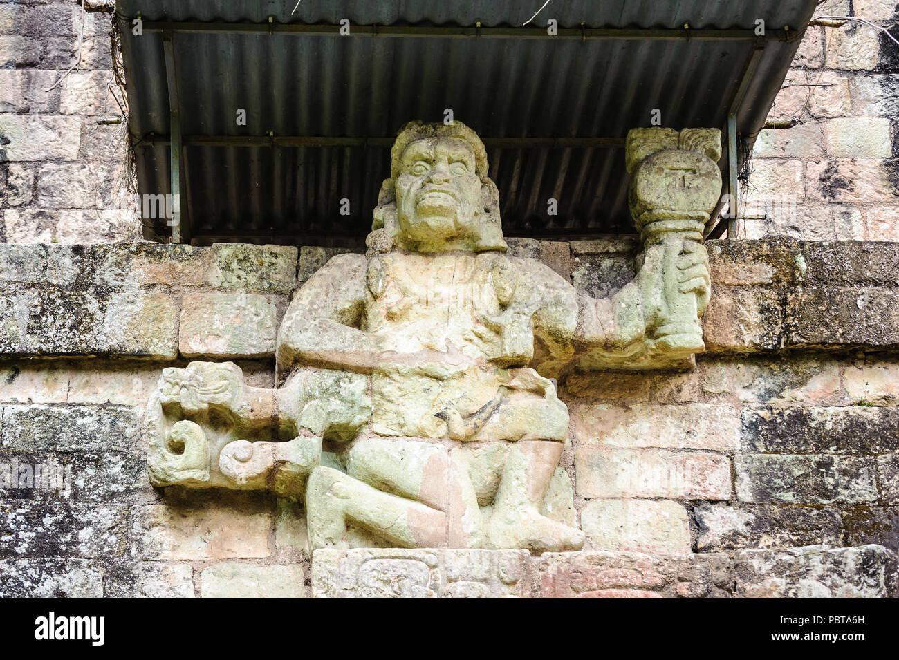 One of two simian sculptures on Temple 11, Howler Monkey Gods. Copan, Honduras Stock Photo