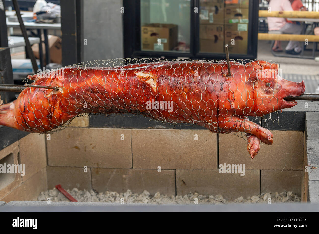BBQ Hog on spit pig barbeque Stock Photo