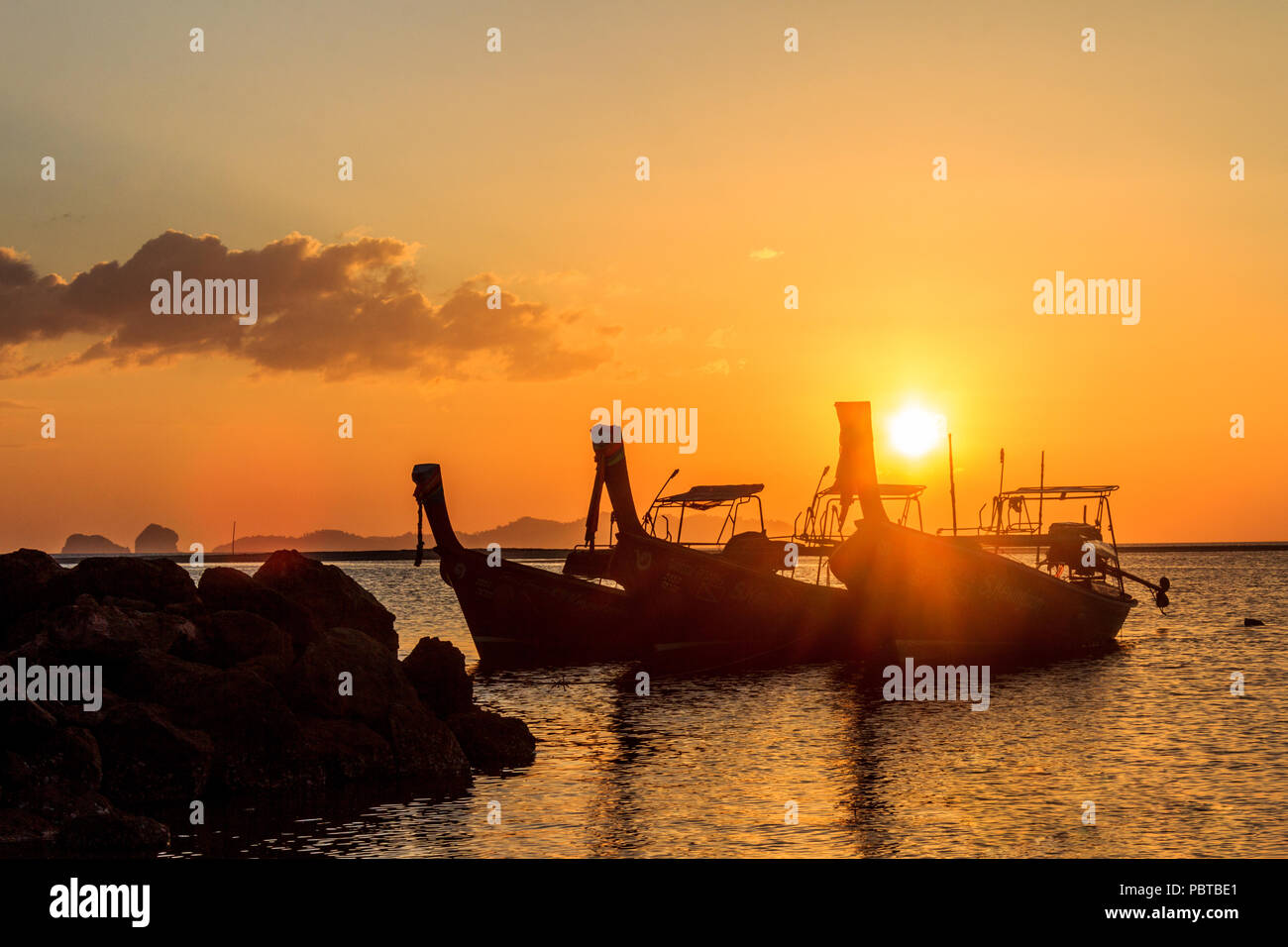 Silhouettes of long tail fishing boats, Pak Meng, Trang Province, Thailand Stock Photo