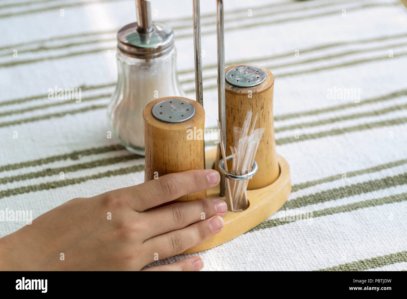 Salt and Pepper shaker on a wooden table Stock Photo
