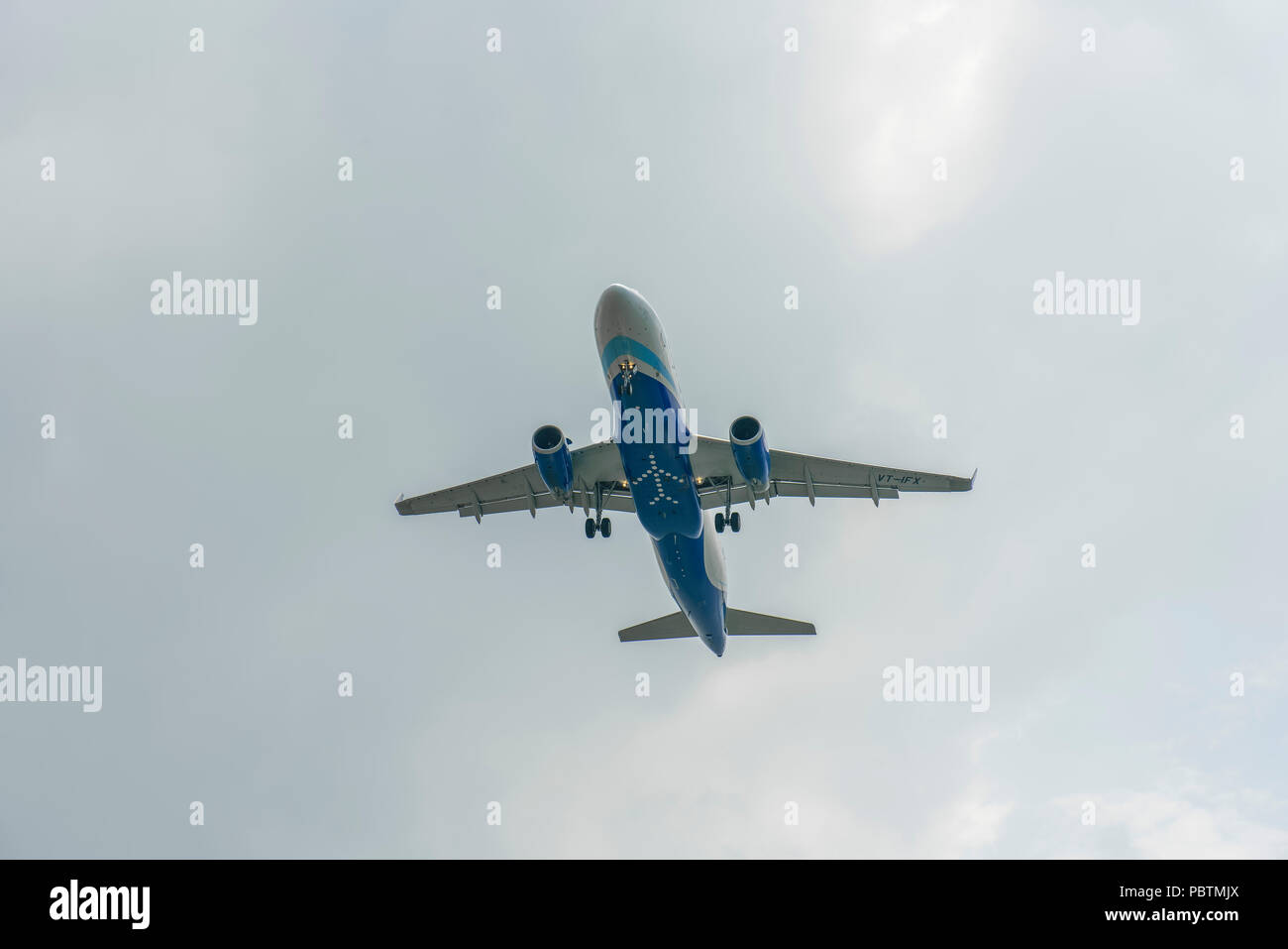 Singapore - June 03 2018: Indian Airliner on final Approach into Changi Airport Stock Photo