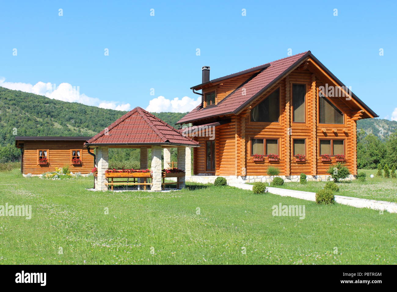 Wooden Log Cabin House With Stone Gazebo And Wooden Log Tool Shed