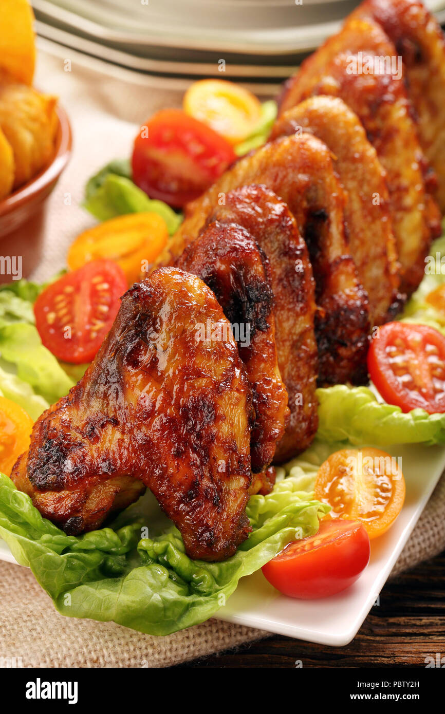 Chicken wings with vegetables Stock Photo