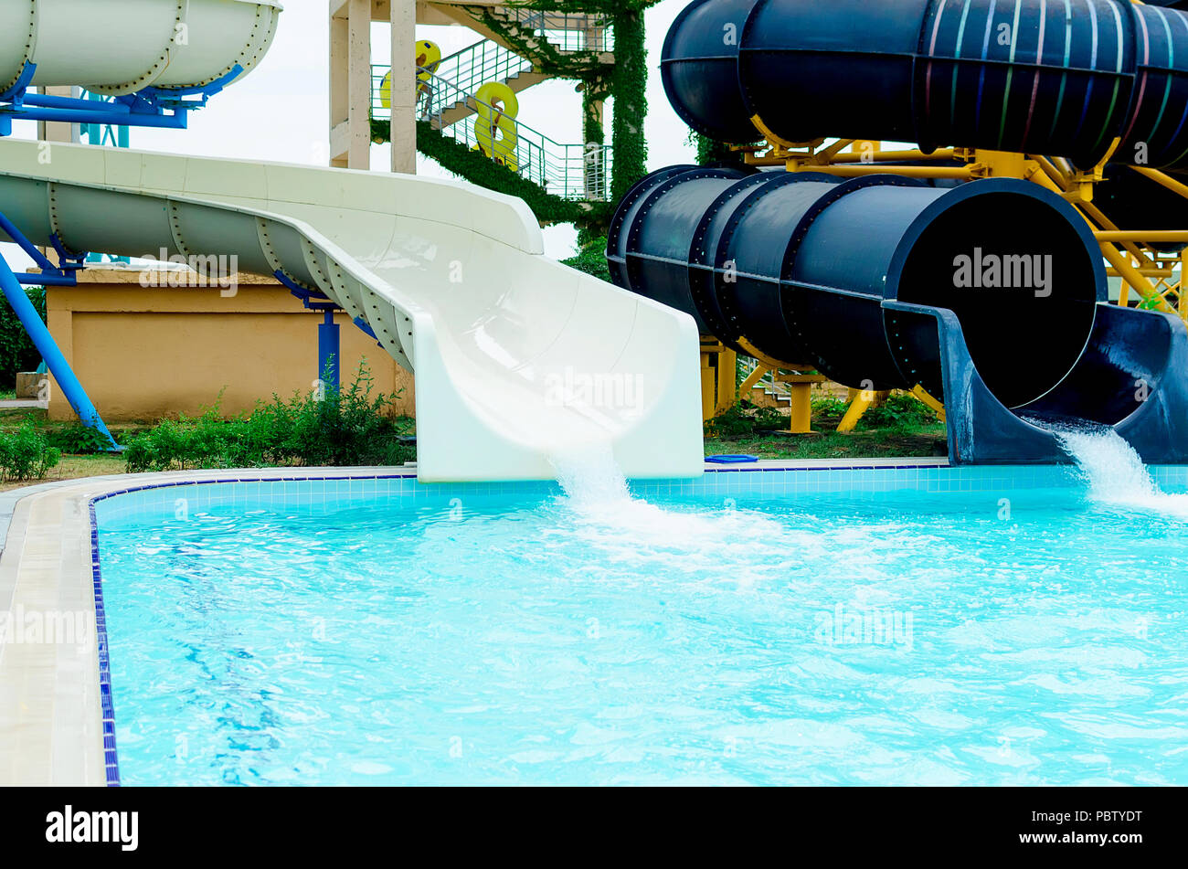 Closeup large colorful water slides, tubes and pool in aqua park / Ukraine, Berdyansk Stock