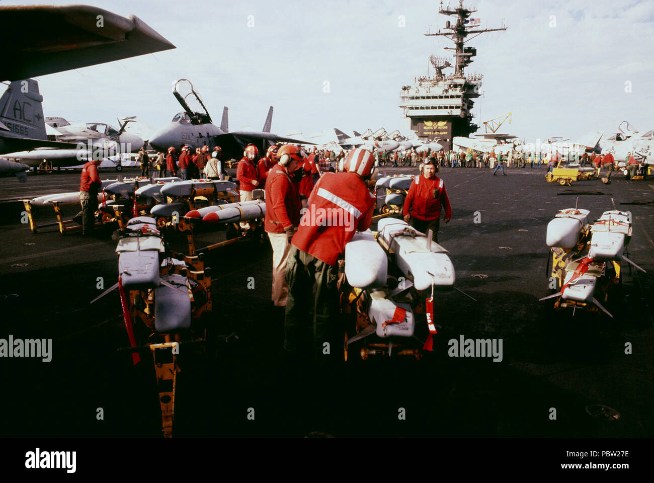 ADM-141 TALD ready to load. Aviation ordnancemen prepare to load ADM-141 tactical air-launched decoys onto aircraft on the flight deck of the aircraft carrier USS JOHN F. KENNEDY (CV-67).  The planes are being fitted for strikes on Iraqi targets at the onset of Operation Desert Storm. Stock Photo
