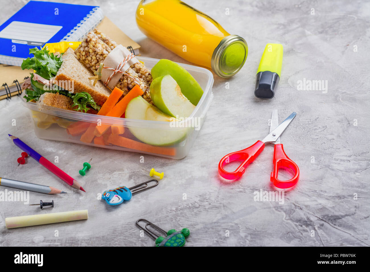 Lunch box and school supplies Stock Photo Alamy