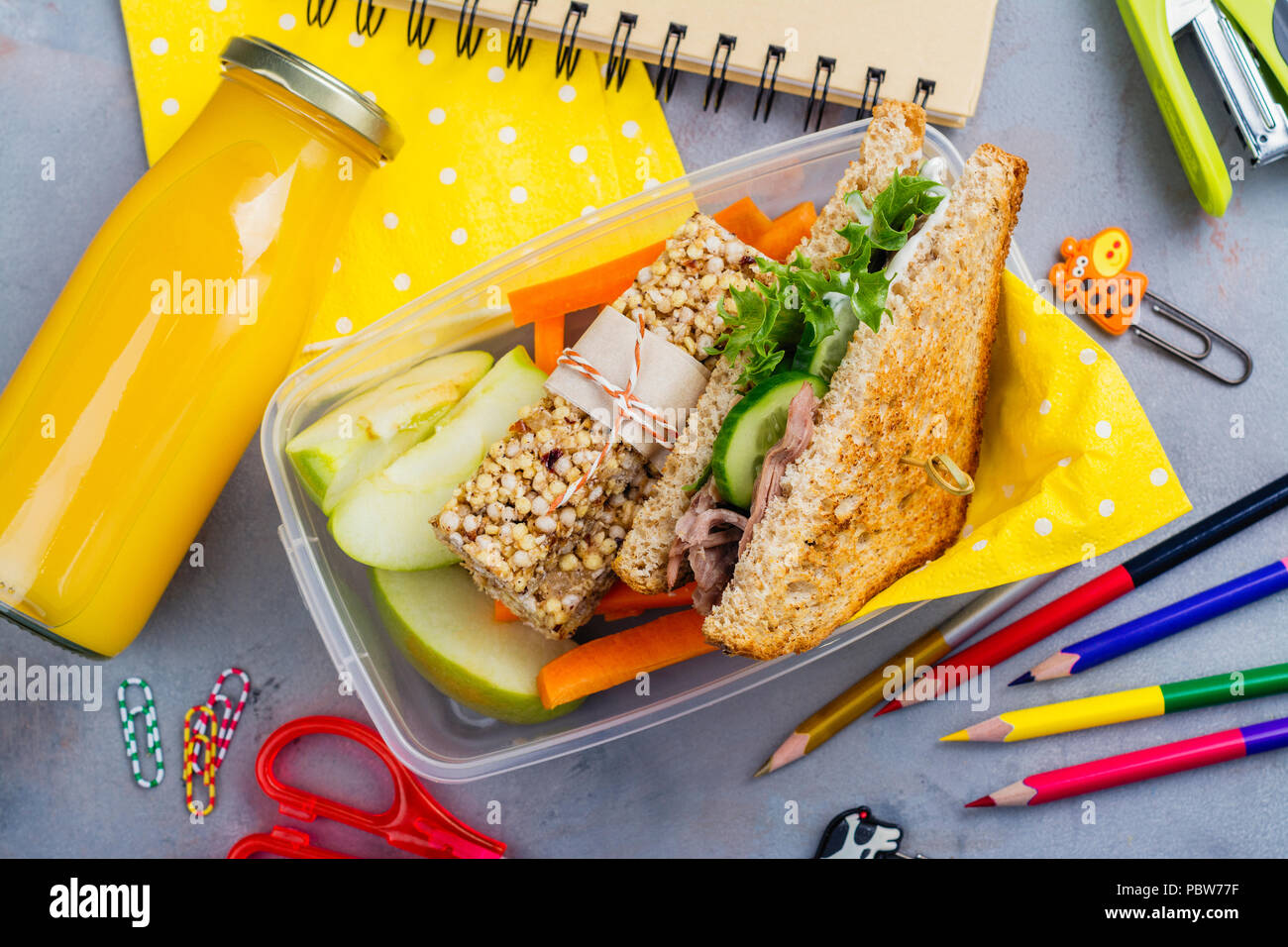 Lunch box and school supplies Stock Photo Alamy