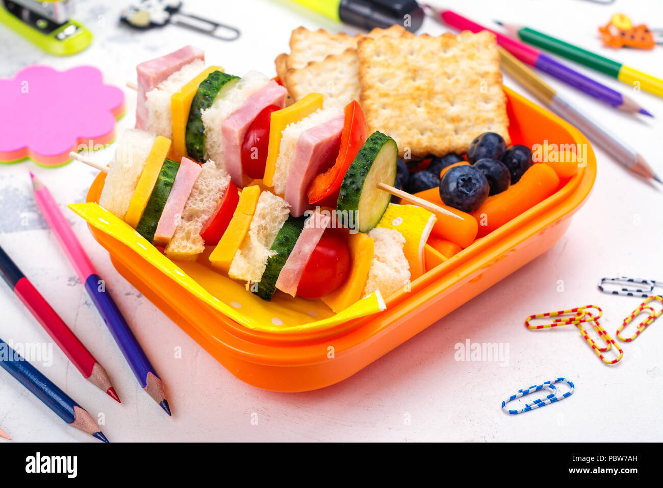Lunch box and school supplies Stock Photo Alamy
