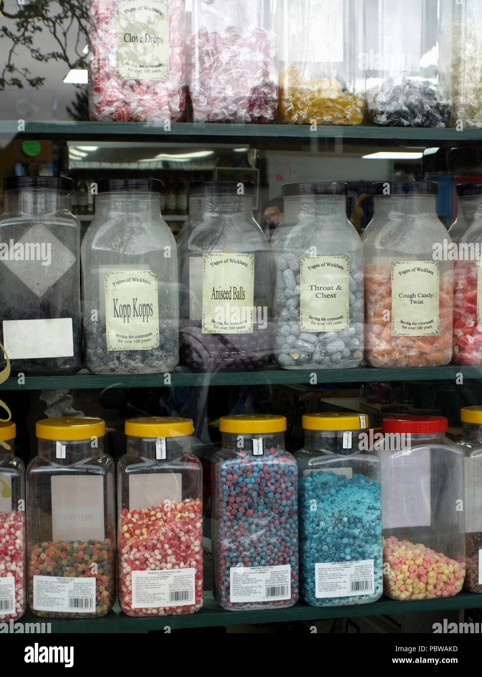 Jars of sweets in shop window in the traditional English village of