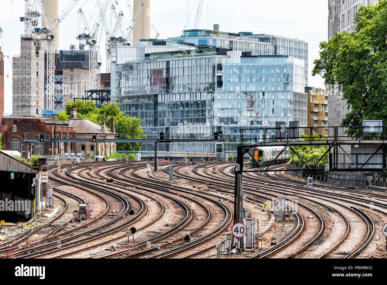 London, UK - June 23, 2018: Industrial railroad tracks in United Kingdom, Pimlico neighborhood district, Abbots Manor to Victoria station transportati Stock Photo