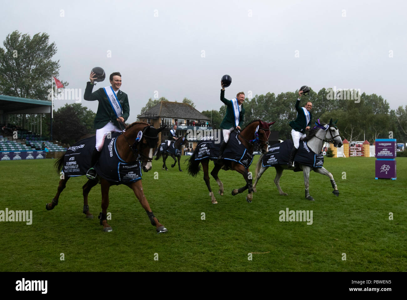 Hickstead(Britain. 30th July, 2018. Team Ireland celebrate after the awarding ceremony for the Longines FEI Jumping Nations Cup in Hickstead, Britain on July 29, 2018. Team Ireland claimed the title. Credit: Han Yan/Xinhua/Alamy Live News Stock Photo