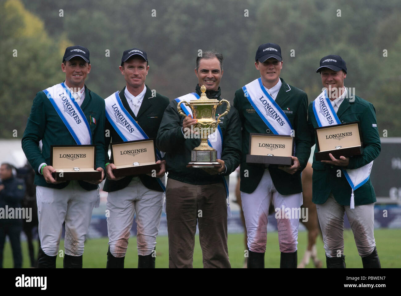 Hickstead(Britain. 30th July, 2018. Team Ireland celebrate during the awarding ceremony for the Longines FEI Jumping Nations Cup in Hickstead, Britain on July 29, 2018. Team Ireland claimed the title. Credit: Han Yan/Xinhua/Alamy Live News Stock Photo