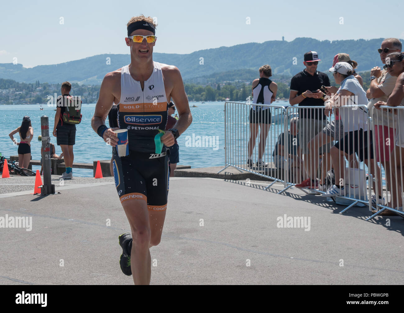 The Switzerland, 2018, Ironman Triathlon: Running course.A contestant running through the city of Zurich, Bellevue. Stock Photo