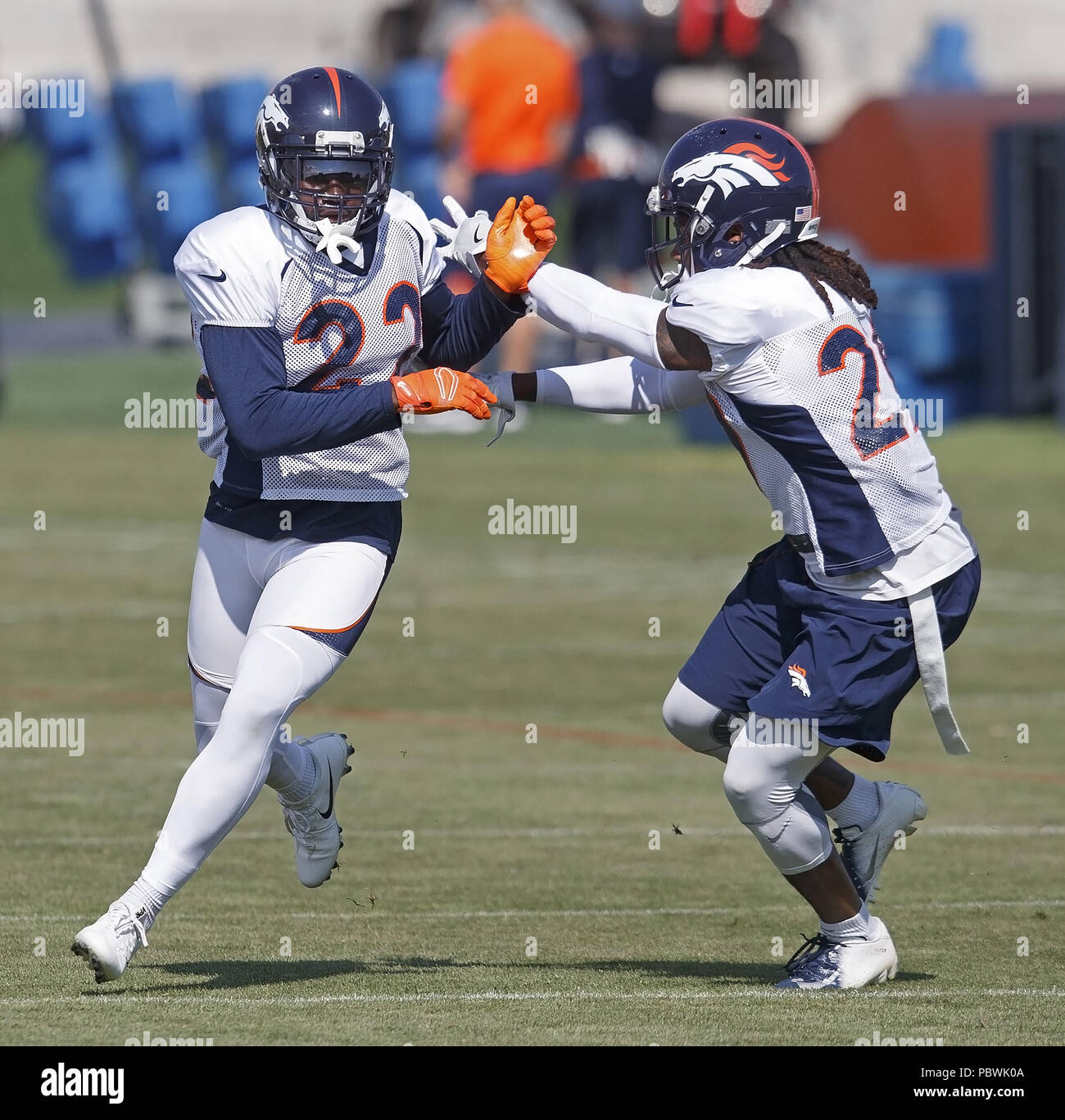 Englewood, Colorado, USA. 30th July, 2018. Broncos CB TRAMAINE BROCK, left, runs through Defensive drills with team mate CB BRADLEY ROBY, right, during the Broncos 3rd. day of Training Camp at UC Health Training Facility at Dove Valley Sunday Morning. Credit: Hector Acevedo/ZUMA Wire/Alamy Live News Stock Photo