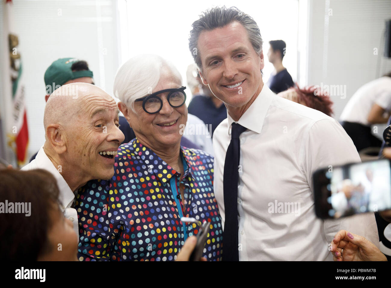 Palm Springs, California, USA. 31st May, 2018. Gavin Newsom, Democractic candidate for governor of California, stands for a photograph with Dennis De Groot, center, as he campaigns during an event sponsored by Equality California at the Mizell Senior Center on Thursday, May 31, 2018 in Palm Springs, Calif. © 2018 Patrick T. Fallon Credit: Patrick Fallon/ZUMA Wire/Alamy Live News Stock Photo