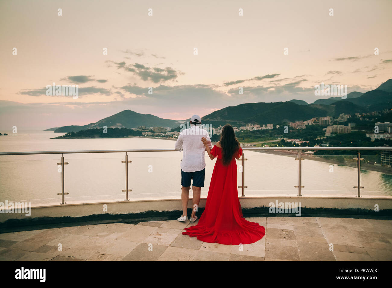 couple relax in hotel with beautiful sunset view. Terrace of hotel at sunset Stock Photo Alamy