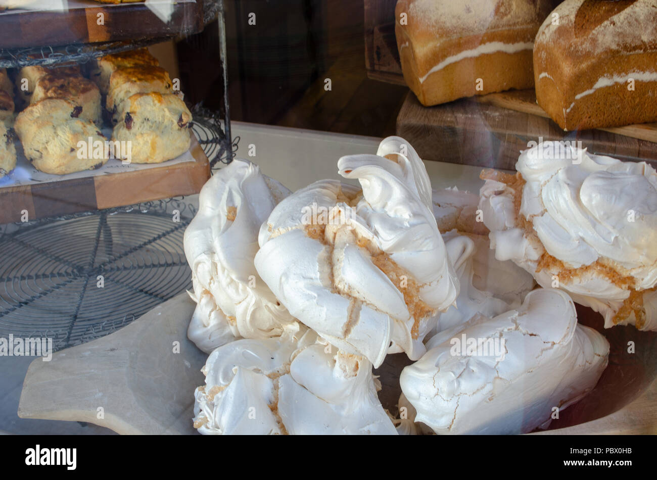 Meringues in Traditional English Bakery shop window Stock Photo Alamy