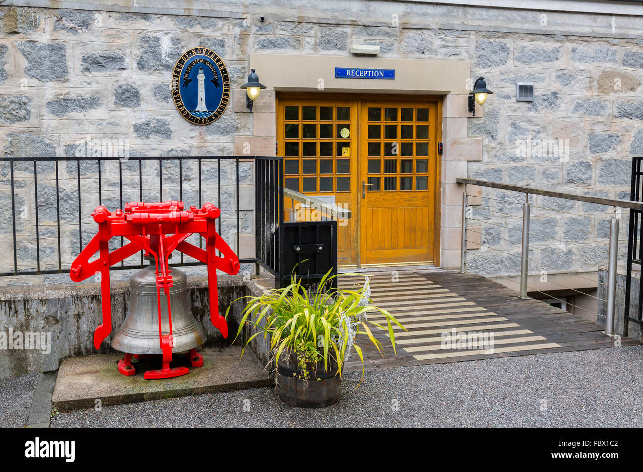 The Commissioners of Northern Lighthouses crest and bell buoy outside the Northern Lighthouse Board depot in Oban, Argyll and Bute, Scotland, UK Stock Photo