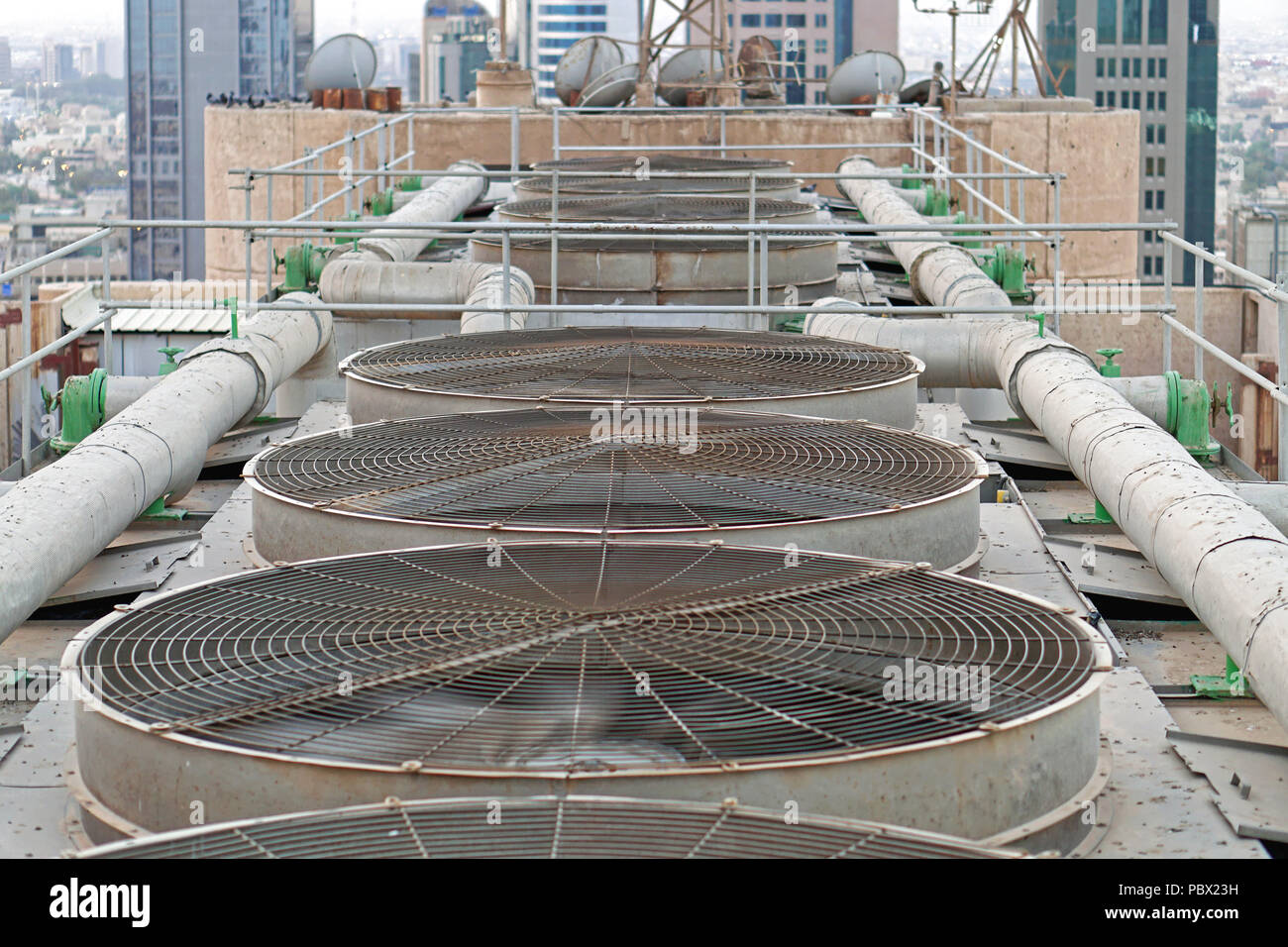 Big ventilation fans cooling system at top of building in Kuwait Stock  Photo - Alamy