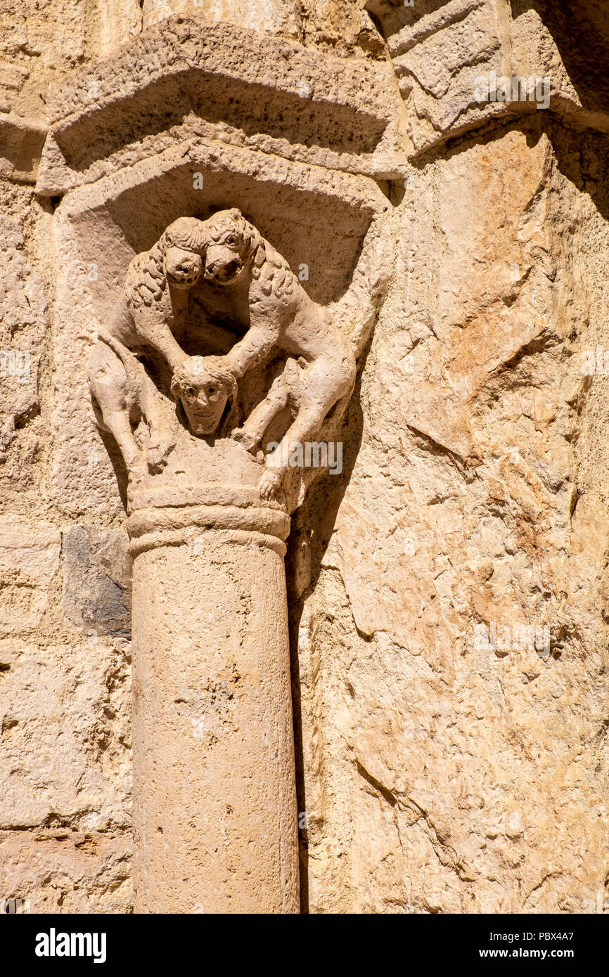 Stone carving on a pillar at the doorway to the Hospital de Sant Julia in Besalu, Garrotxa, Catalonia, Spain Stock Photo