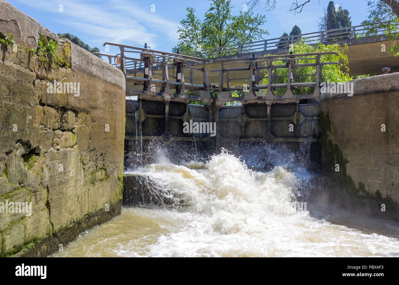 Canal du Midi, Carcassonne, French department of Aude, Occitanie Region, France. Lock gates opening on the canal. Stock Photo