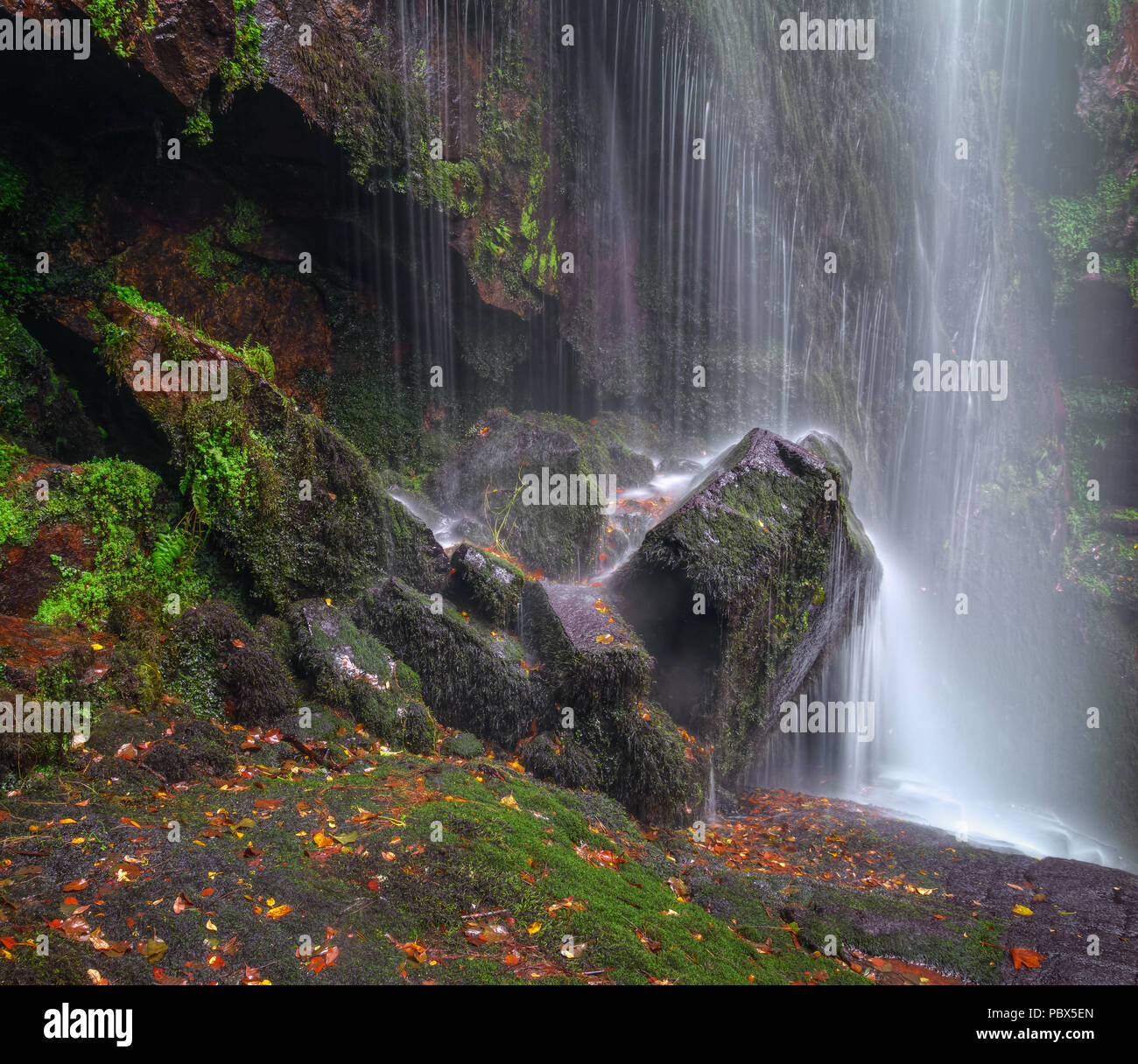 Waterfall on a rock covered with moss, in Augacaída, Pantón, Ribeira Sacra, Galicia Stock Photo