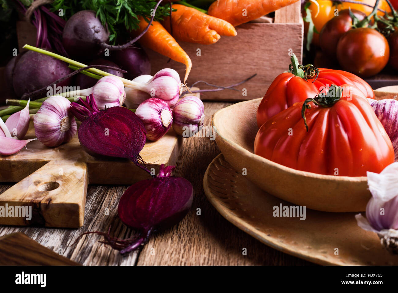 Fresh organic homegrown colofrul vegetables on wooden rustic table, harvest time Stock Photo