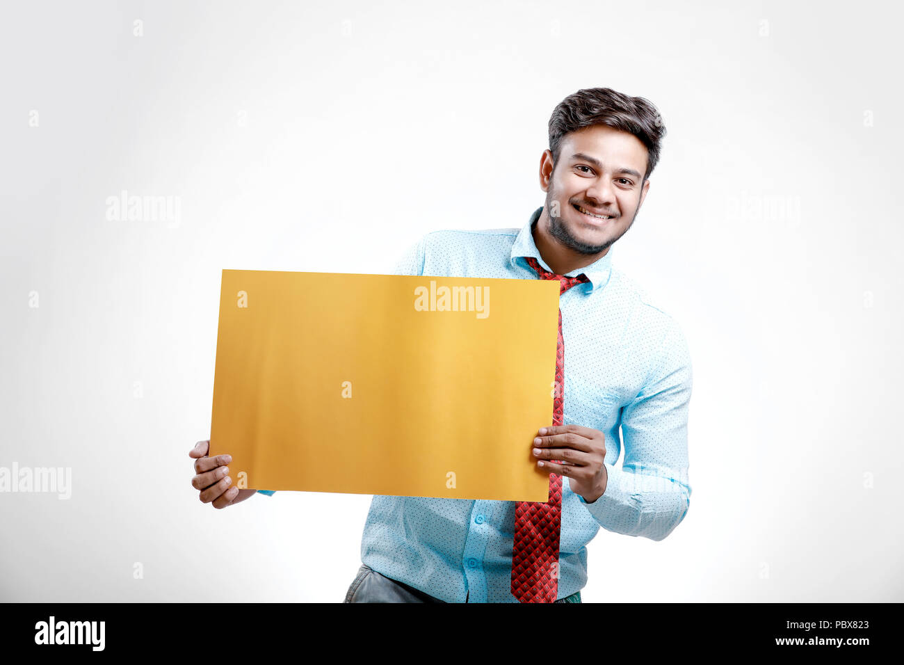 Indian young man showing blank hi-res stock photography and images - Alamy