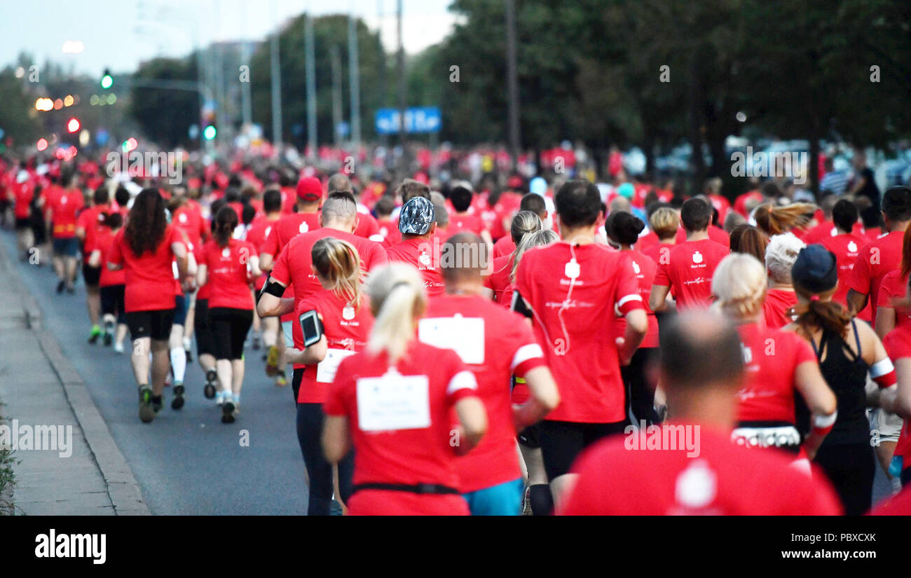Thousands of people participate in 28th Warsaw Uprising Run on July 28, 2018 in Warsaw, Poland.  The runners commemotate those who fight and died in a Stock Photo