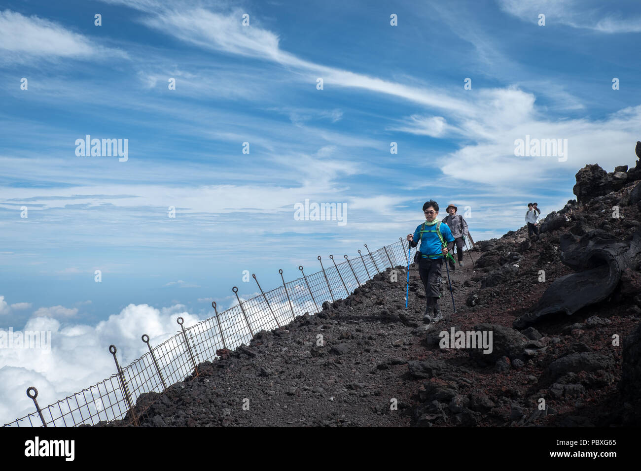 Walking on the summit of Mount Fuji (altitude 3776 meter) in Japan Stock Photo