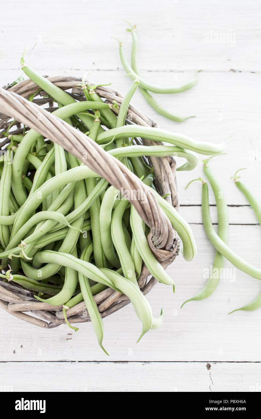 Group of green beans on white table Stock Photo
